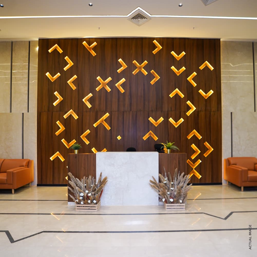 Cornerstone Worli lobby with feature wall and lounge seating